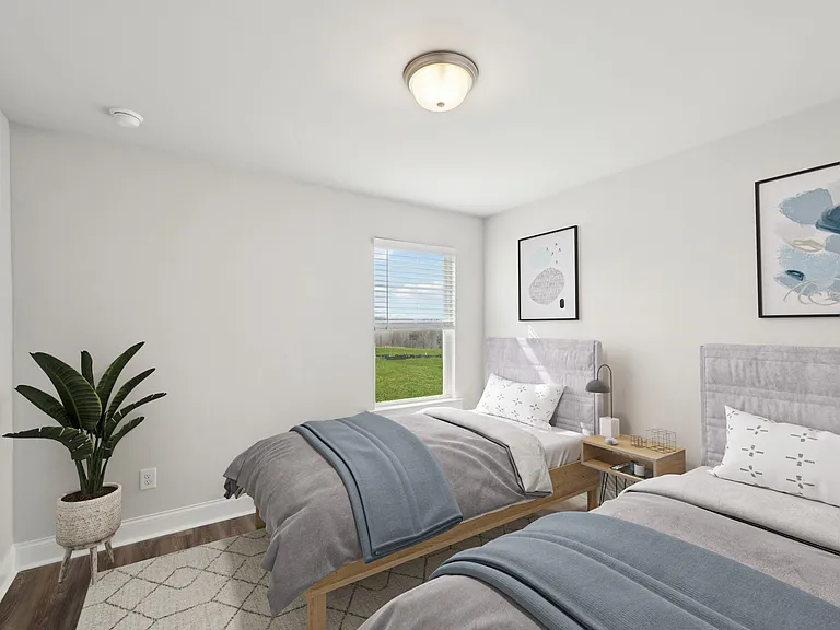 Secondary suite with two twin beds, ideal for guests.