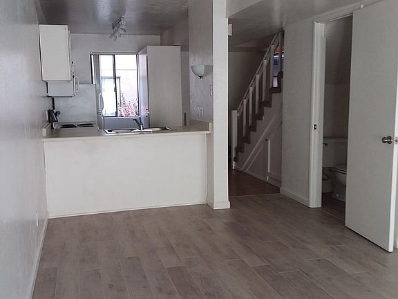 Living area, kitchen and half bath.