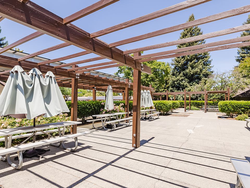 Spacious outdoor patio with shaded seating.