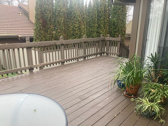 Large rear deck off small fenced yard.