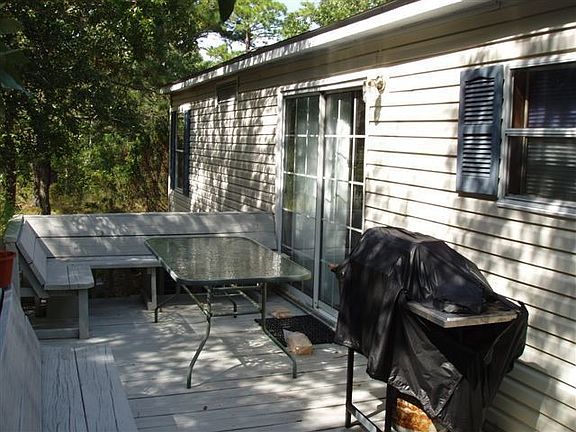 Deck overlooking treed yard