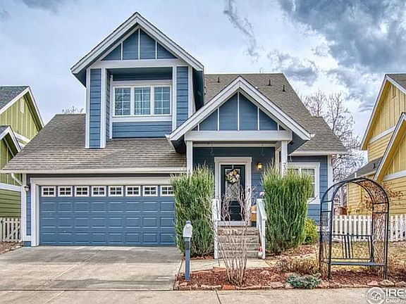 Beautiful two story with finished basement, 2-car garage, bike racks. House entry on two sides with patio and small gardens.