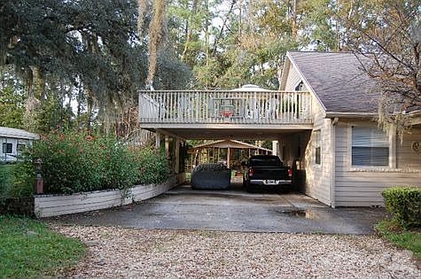 Carport & Deck above