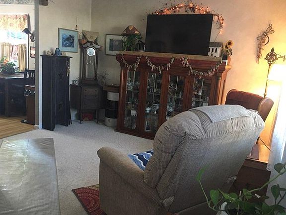 Carpeted living room set from front door view