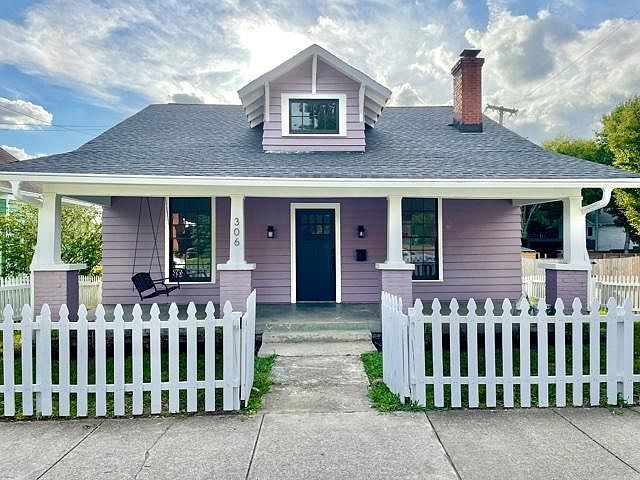 Front of house. Porch swing.