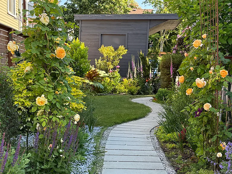 Walkway through the garden to your private entry, looking north.