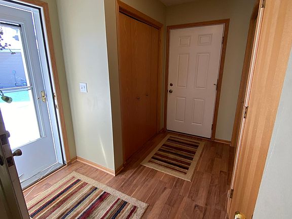 Mud room with large coat closet and access to the front door and connected one-car garage