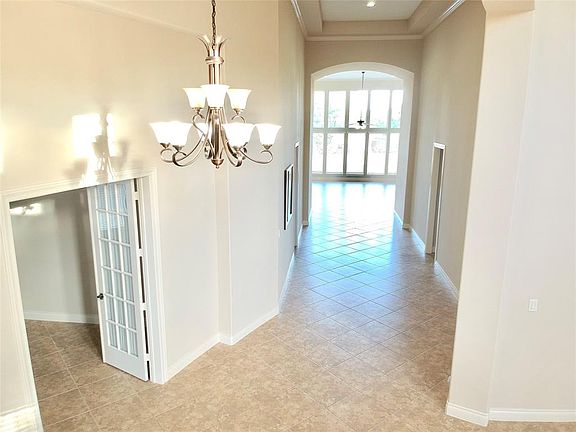 Towering ceilings, wide hallways and tall windows provide a spacious and well lighted atmosphere as you enter your home. Yes, this entire home is one story.