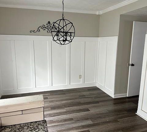 Large dining room with double doors leading to patio