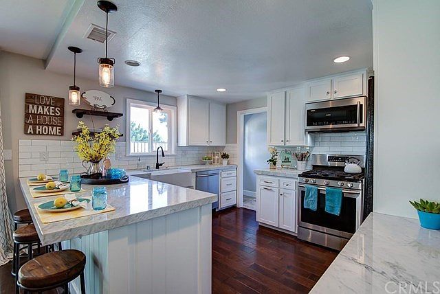 Gorgeous redesigned kitchen with all new cabinets, marble counter tops and brand new stainless steel appliances.