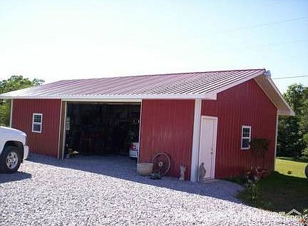 Pole Barn!! : Just built pole barn! Has electricity and shelving! Very nice garage door.