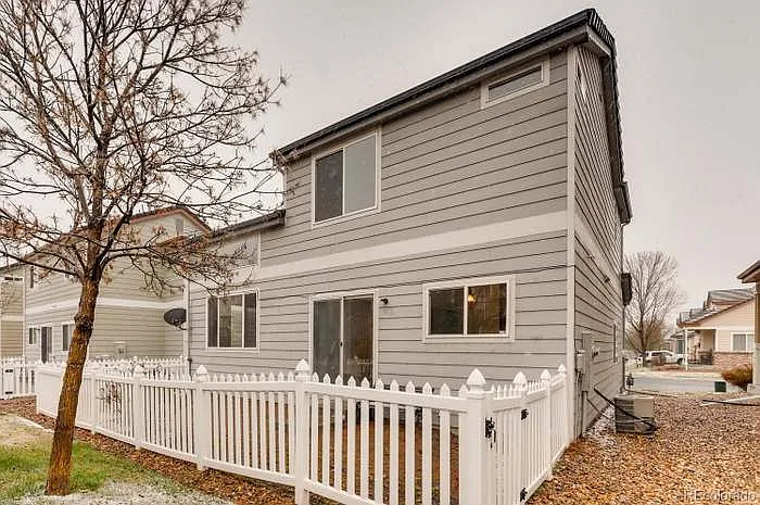 Back of house & patio/fence. - 13960 Monroe St