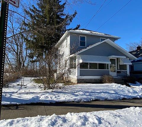 Enclosed 3 seasons porch at front of home
