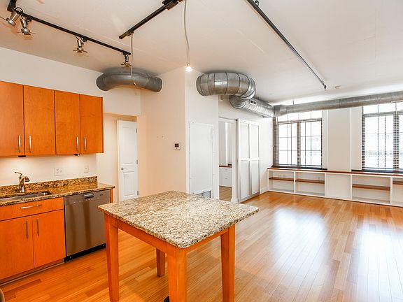 Spacious living area with built-in bookcases overlooking trendy Church St!