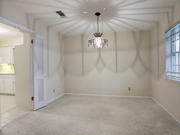 Dining room is well sized and could easily accommodate a 10-12 person table and chairs. Charming lighting adds to the ambiance of the room.