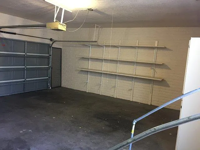 double garage has storage cabinet