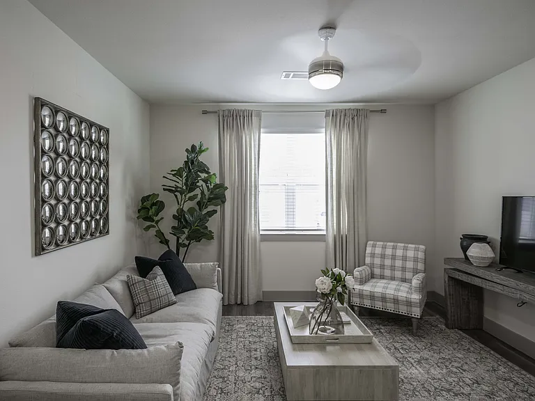 Open living area with Ceiling Fans