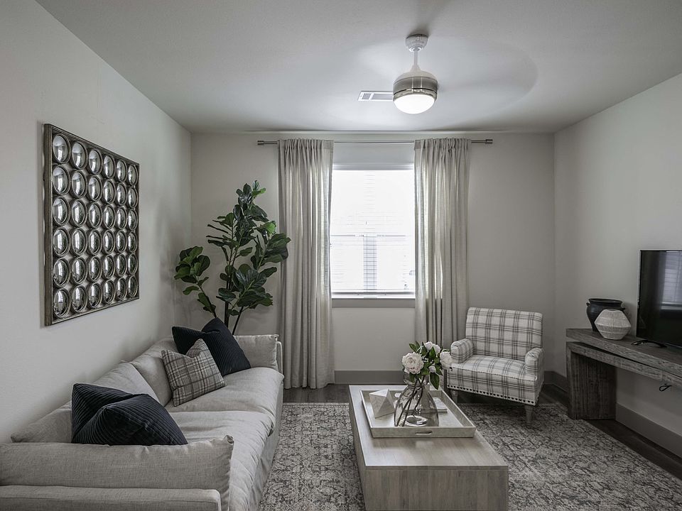 Open living area with Ceiling Fans