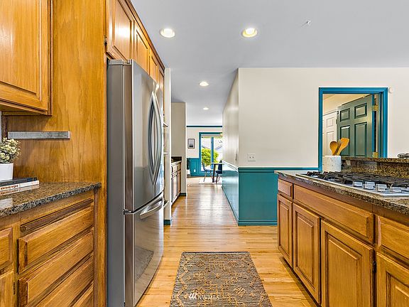 Hardwood floors and an abundance of cabinet and counter space