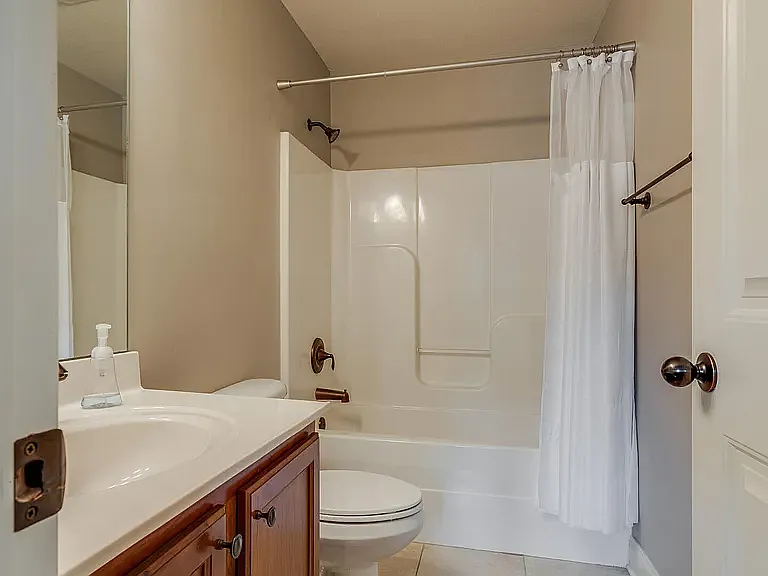 Hall Full Bathroom with Tile Floor
