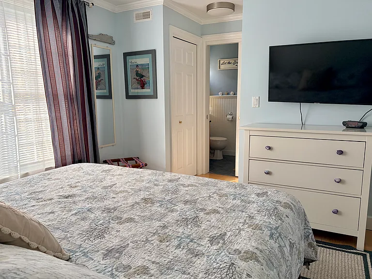 First floor bedroom with king bed. Large dresser and two closets to fit all your clothes and shoes.