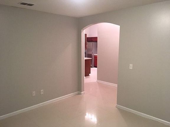 Looking into kitchen from bonus room located off the front entry.