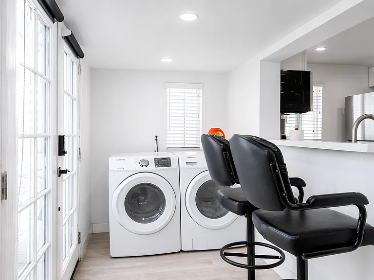 Laundry area with washer and dryer for guest use
