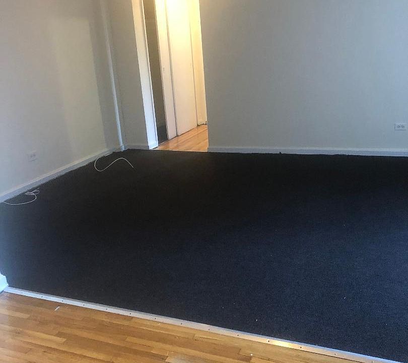 Kitchen area entering spacious living room area