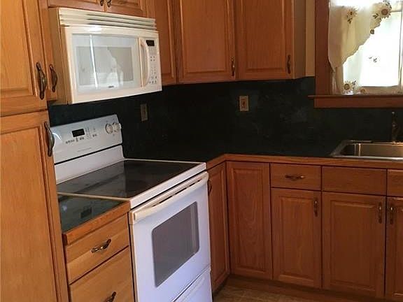 New Kitchen with raised panel cabinets & beveled edge countertops