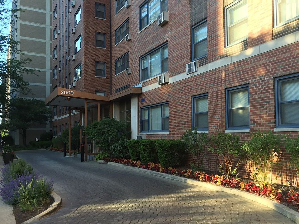 Exterior front driveway entrance with bus stop at the front door.