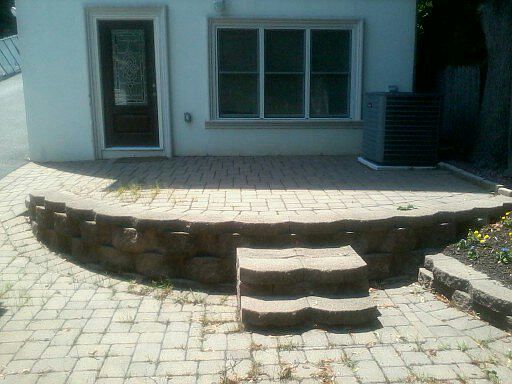Brick patio. Plenty of room for a grill and patio furniture. Private...quiet...and fenced.