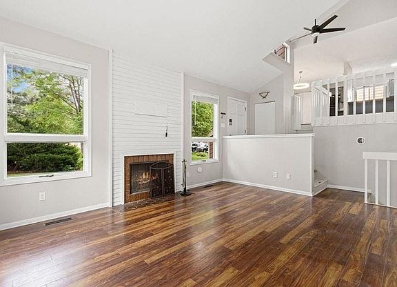 Family Room With Wood Burning Fireplace.