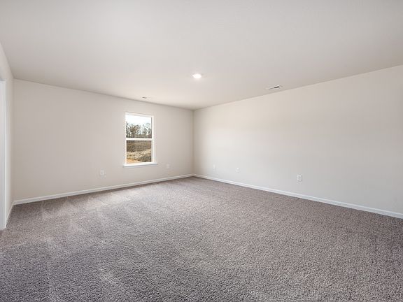 Rest and relaxation await in this spacious master bedroom