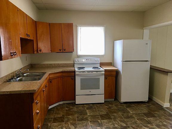 Kitchen in the from. Photo taken from the dining area