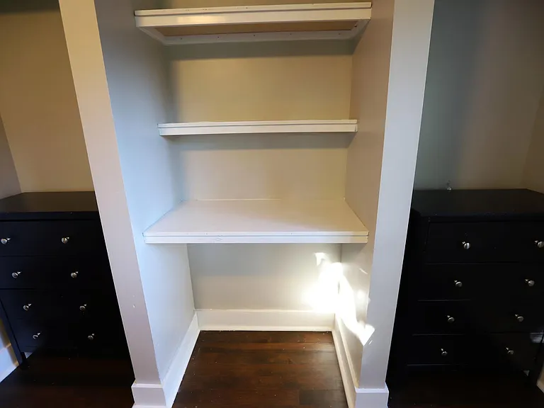 Close up of built-in shelves found in bed 2. Bed 1 shelves are similar size.