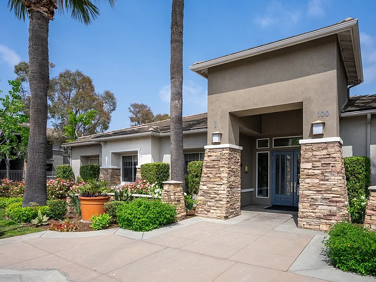 Leasing Office Entrance at Camino Real Apartments with Stacked Stone Columns