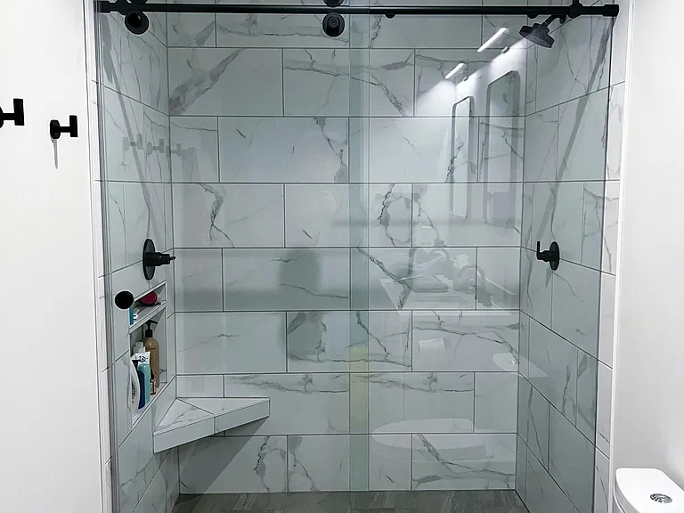 Shower with rain head option.