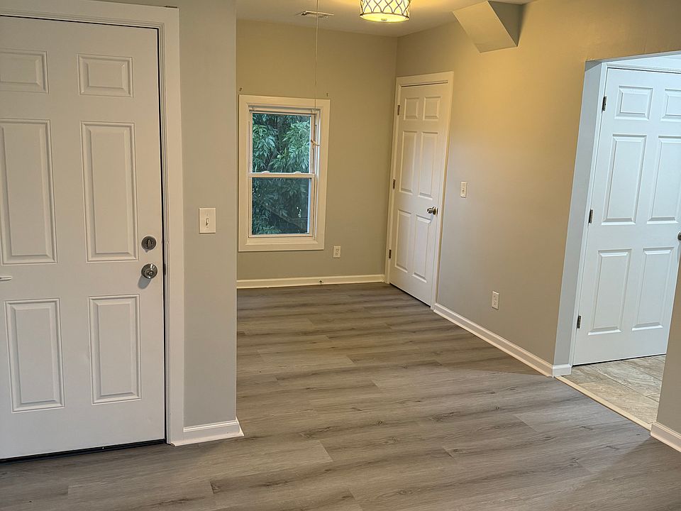 Living room with closet near window