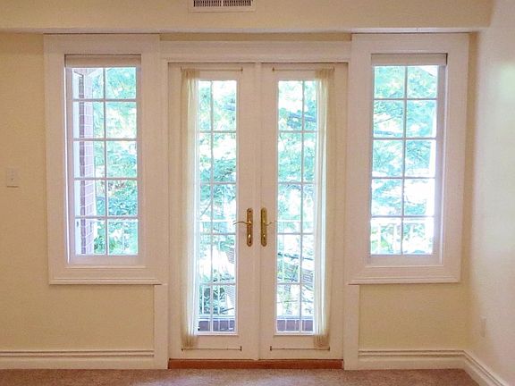French doors have window coverings