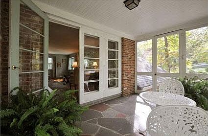 Screen porch with French doors connect the Living room