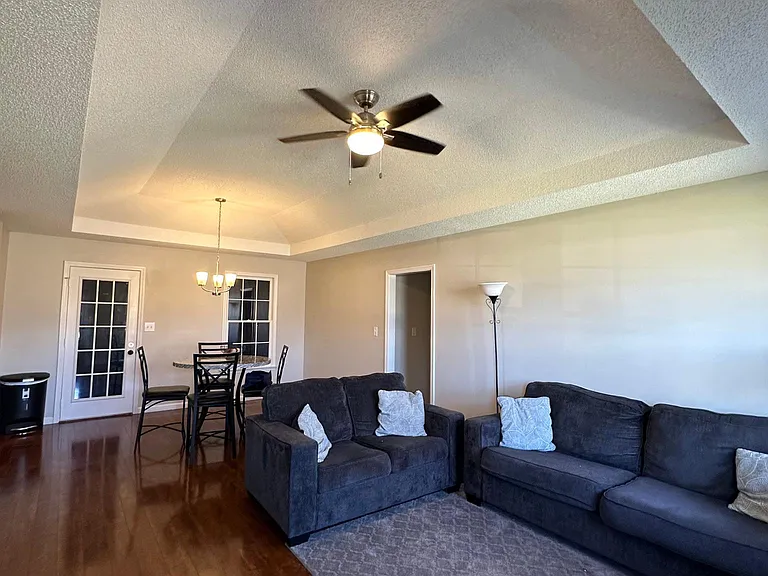 Common area living room with furniture provided.