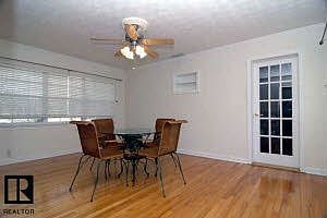 dining room with the door out to the garage bedroom