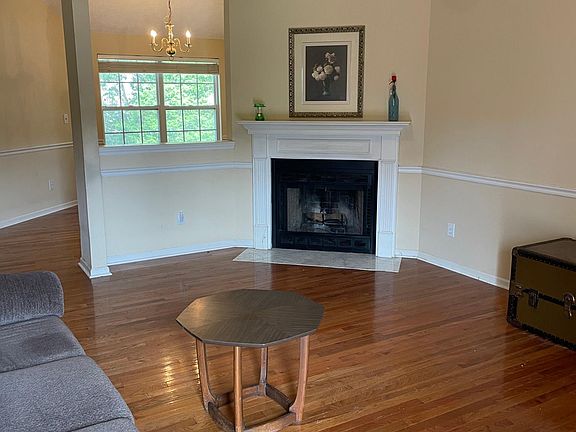 This is the view when you enter the home! Wood-burning fireplace with Oak hardwood flooring in living room & dining room.