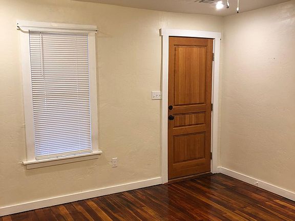 Living Area facing the Front Door and Window from the Kitchen Area