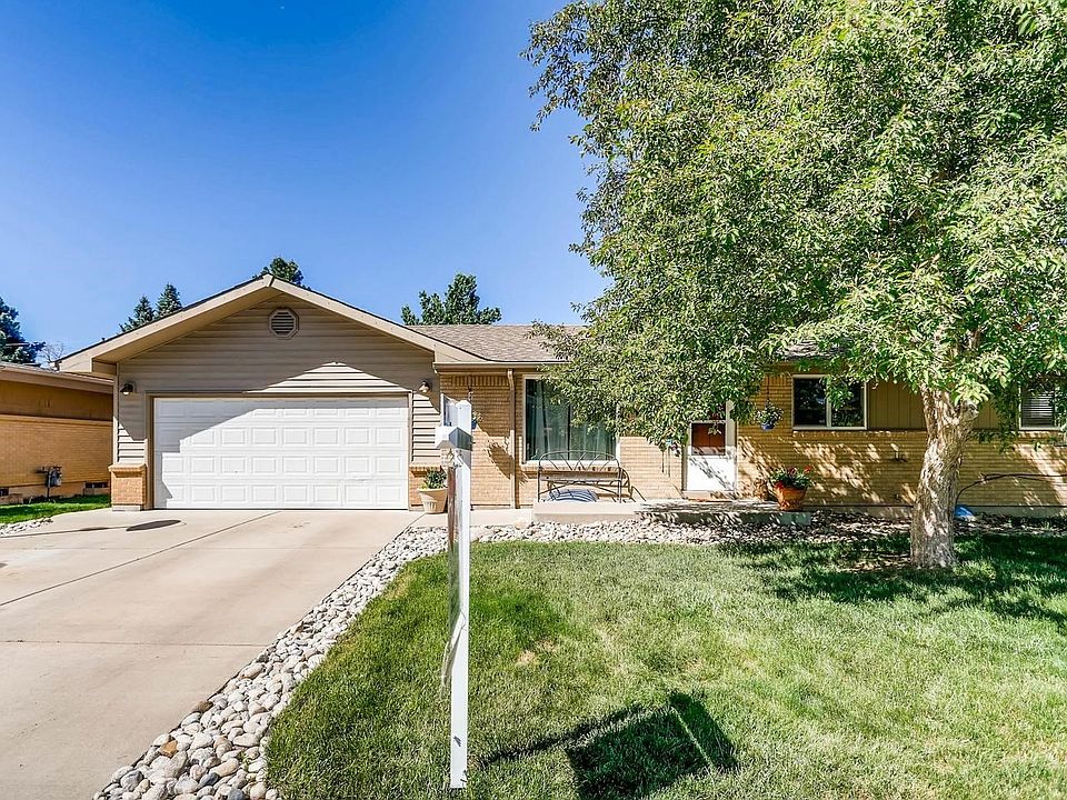 Rare 4 car garage home that is just steps to the Highline Canal and Milliken Park!