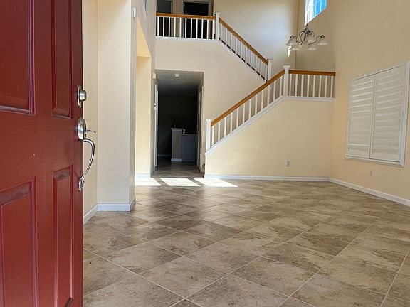Entry to living room and Dining room with high ceiling.