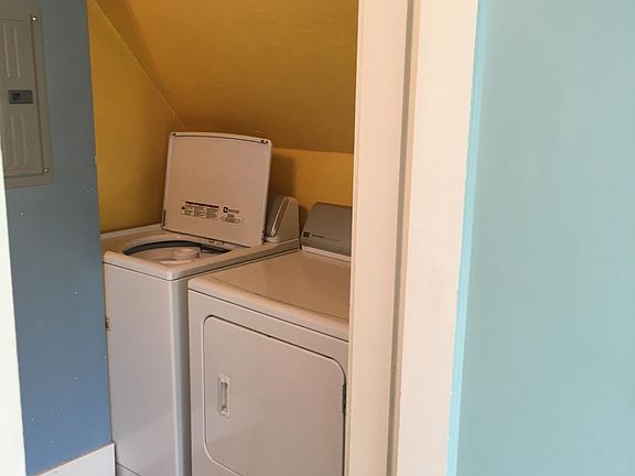 Laundry nook from living space.