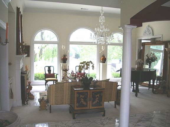  Living room with stunning lake views, fireplace and arch details