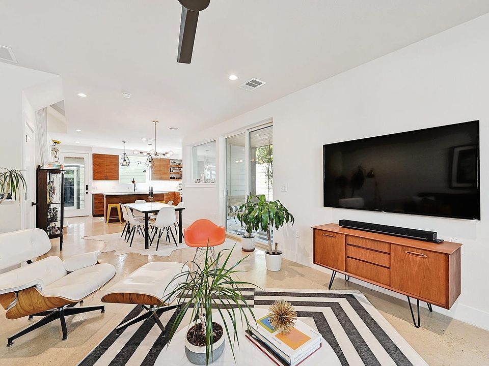 Open Floorplan joining the dining and living together with a patio door that allows living to spill over onto the covered deck.