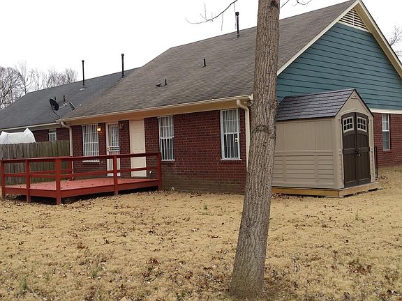 3670 Jireh Dr - back view with deck and storage